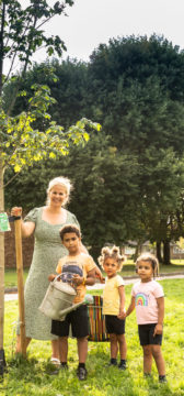 Woman and children next to tree